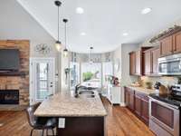 Natural wood flooring throughout living area