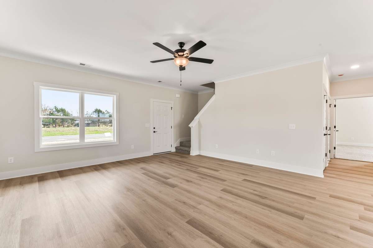 The double-window has a great view of the front yard and covered front porch.