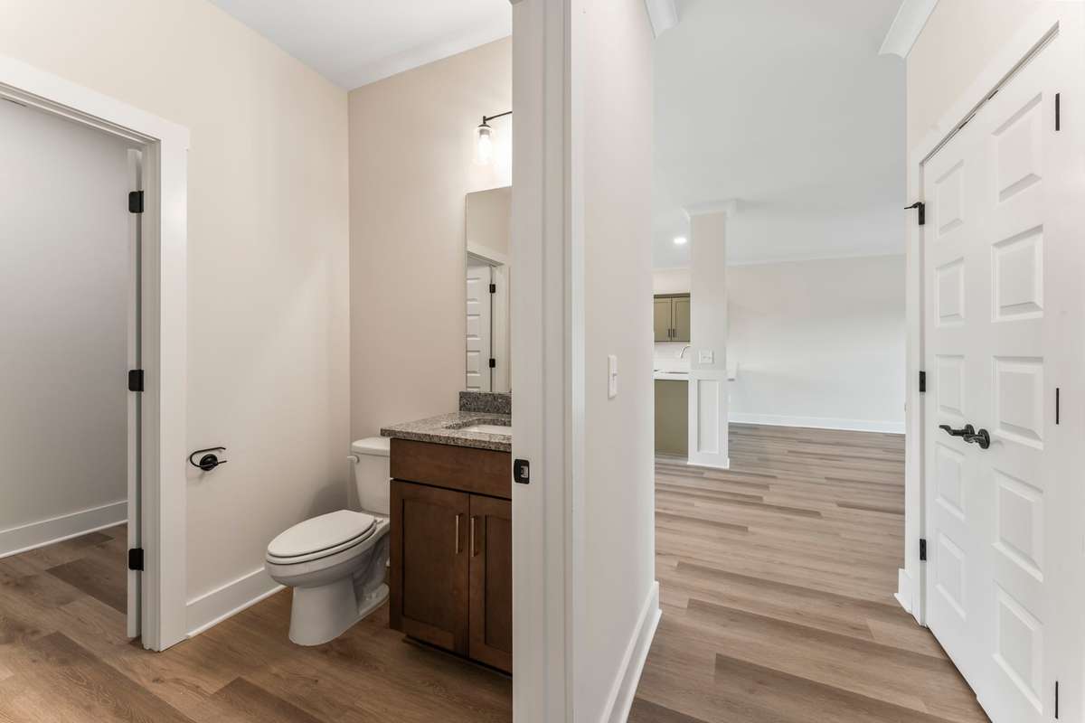 Just off the living room you'll fine the half bath and laundry room!