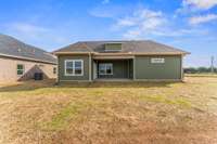 Access to the covered back porch is through the dining area, just off the kitchen.
