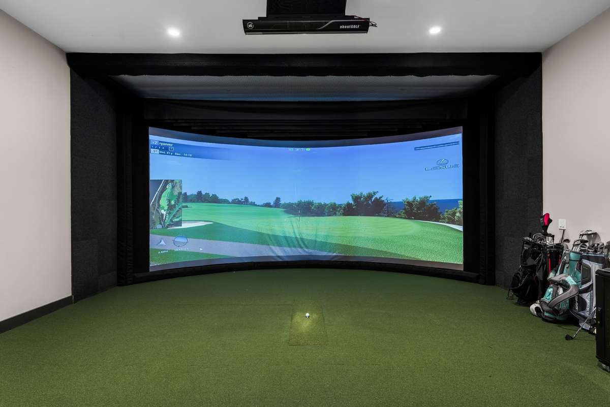 Golf simulator- just another one of the building's luxurious amenities