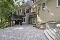 Beautiful pavers and built-in planters, stone stairway to upper level