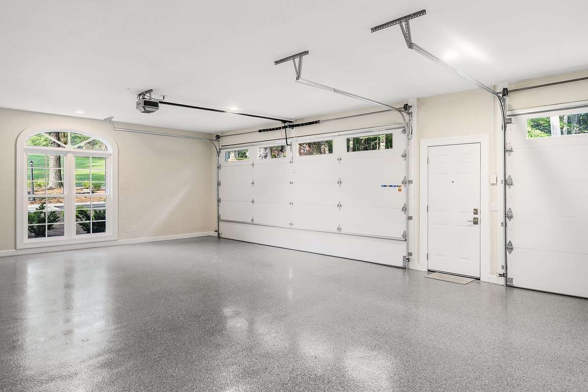 3-Car garage with new doors and openers, new Epoxy flooring!