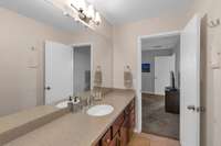 Extra large vanity area. Could easily be converted to double vanities. Knee space for seating area as well. Separate walk-in shower and toilet area for privacy.