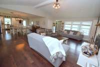 Large family room area with cathedral style ceiling