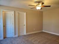 Another View of the Large Primary Bedroom on the Main Level.  Picture of Previous House.