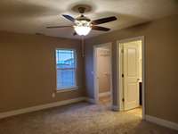 Owner's Suite has Walk-In Closet and Full Bathroom. Picture of Previously Built Home.