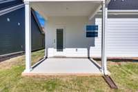 Enjoy your covered back porch—ideal for morning coffee, afternoon reading, or greeting neighbors in style. A private, shaded spot that perfectly extends your living space outdoors.