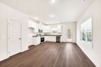 The L-shaped kitchen provides a stress-free cooking environment, with plenty of room to add an island and features a pantry. Its open layout makes it easy to move around, prep meals, and stay connected with the rest of the home.