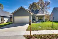 Charming one level home w/hardie board exterior, white trim & 2-car garage. Covered entry, manicured lawn & mature trees. Inviting curb appeal in a serene suburban setting—your dream home awaits!