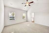 The vaulted ceiling opens it up in a calm, airy way, and the soft light from both windows gives it an easy, relaxed vibe. It’s the kind of space you walk into at the end of the day and instantly feel yourself unwind.