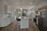 Picture of model home, same plan, to help you visualize furniture.