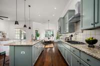 A pot filler above the gas range adds convenience while cooking.