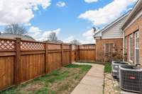 The private outdoor courtyard features a built-in irrigation system, ensuring low-maintenance, lush landscaping.