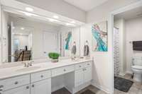 Guest bath features generous space and double sinks for convenience.