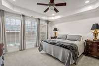 Oversized primary bedroom offering ample space for a sitting area or additional furniture.