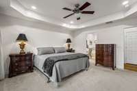 The trey ceiling adds architectural detail and enhances the room’s spacious feel.