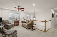The upstairs loft offers a comfortable, versatile space perfect for guests or casual living.