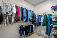 Large, spacious primary closet.