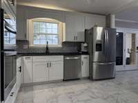 Deep Custom Sink Overlooking the Backyard