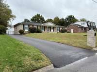 Long Paved Driveway to Detached 2 Car Garage, with Fully Fenced Backyard