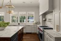 Enjoy the outside even if you are in the kitchen through the windows that open for you to be with everyone that isn on the deck or in the pool