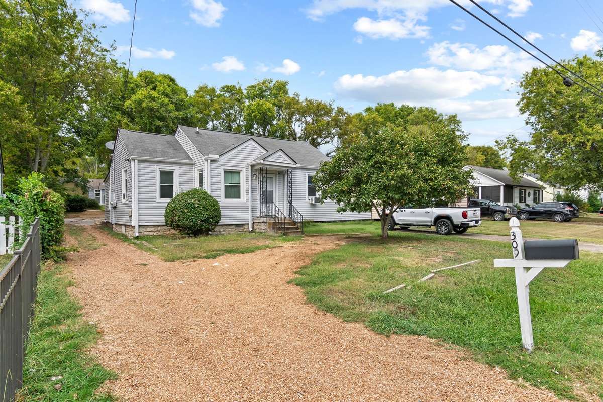 Welcome to an incredible investment opportunity. Inside front door, there is a 1 bedroom, 1 bathroom space which is separated from the rest of the house. Dedicated parking spots in front of house.