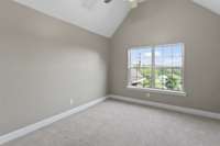 3rd bedroom overlooking front lawn and cul-de-sac.