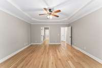 The primary bedroom is located on the main level with ensuite bath and huge walk-in closet.