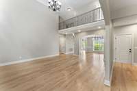 From the living room looking towards the dining room and foyer. The open floor plan provides an aesthetically pleasing atmosphere.