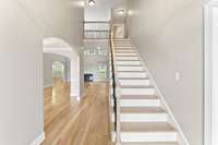 Entry with 2 sty Foyer and statement lighting.