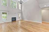 The natural light provides a strong connection between the indoor and outdoor spaces. Primary bedroom is located to the right of the living room.