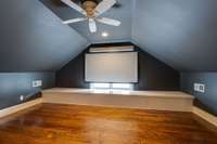 The projector screen conveys with the house.