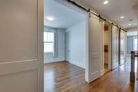 The smallest of the 3 bedrooms has 2 barn doors allowing it to be used as a home office, a home gym or a nursery.