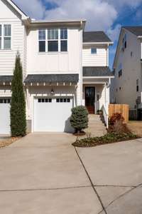 Charming front elevation with inviting curb appeal, highlighting the home's refined design and the welcoming presence that defines this Sylvan Park gem.