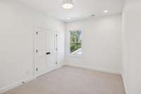 Upstairs bedroom with walk-in closet and premium carpet