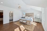 Primary bedroom with lots of natural light, walk-in closet and ensuite bath