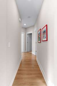 Hallway to the secondary Bedrooms. Separated from the Owners Suite for excellent Privacy