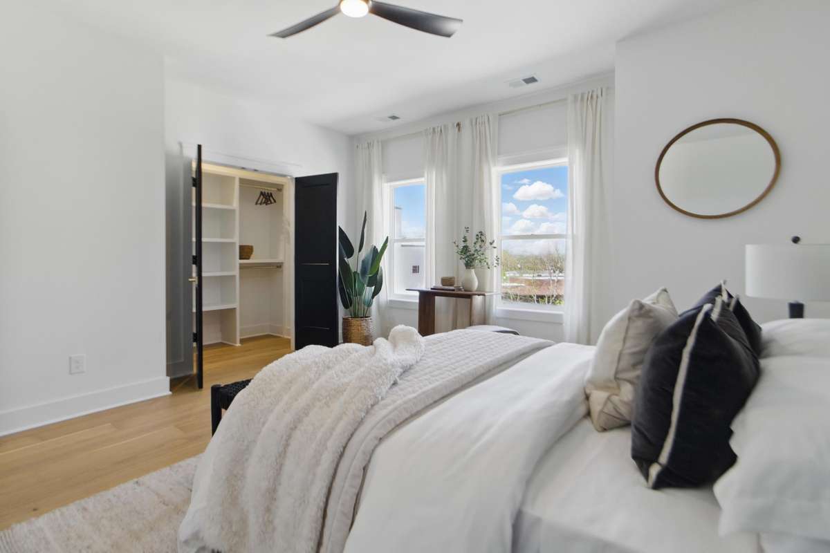 large walk in closet with custom shelving