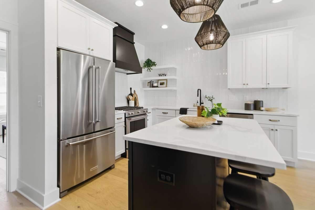 High end gas appliances, under cabinet lighting, exposed shelving