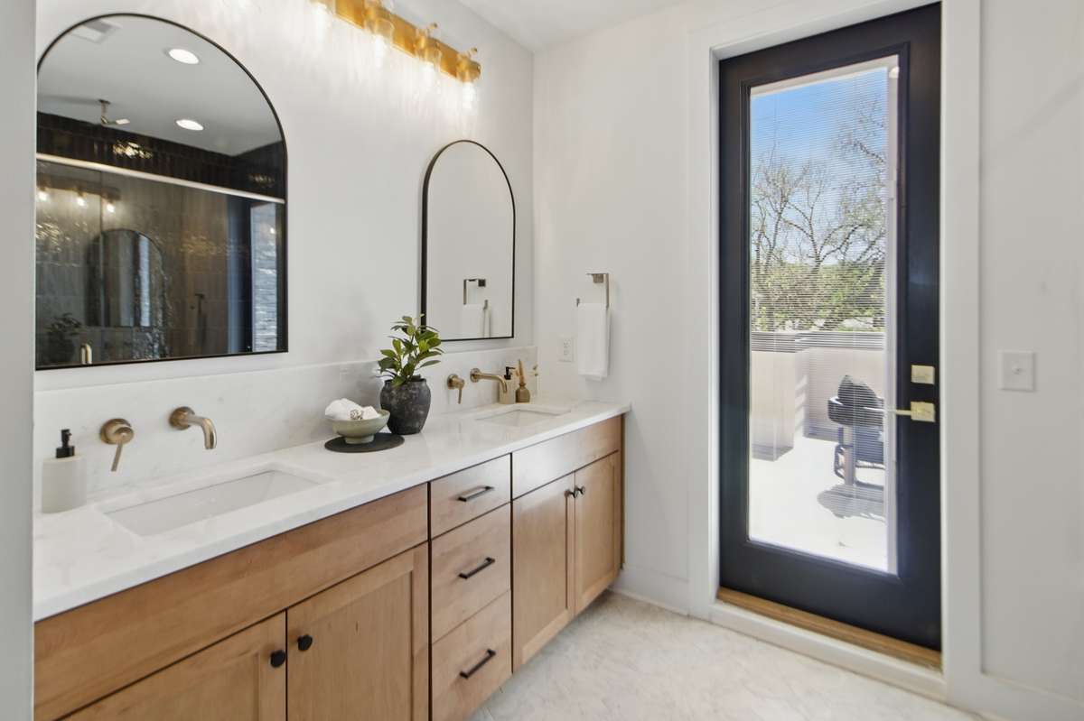 Primary bedroom en suite - double vanity, lots of countertop and cabinet space and access to the roofdeck