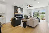 2nd floor - large living room, built in electric fireplace, covered balcony