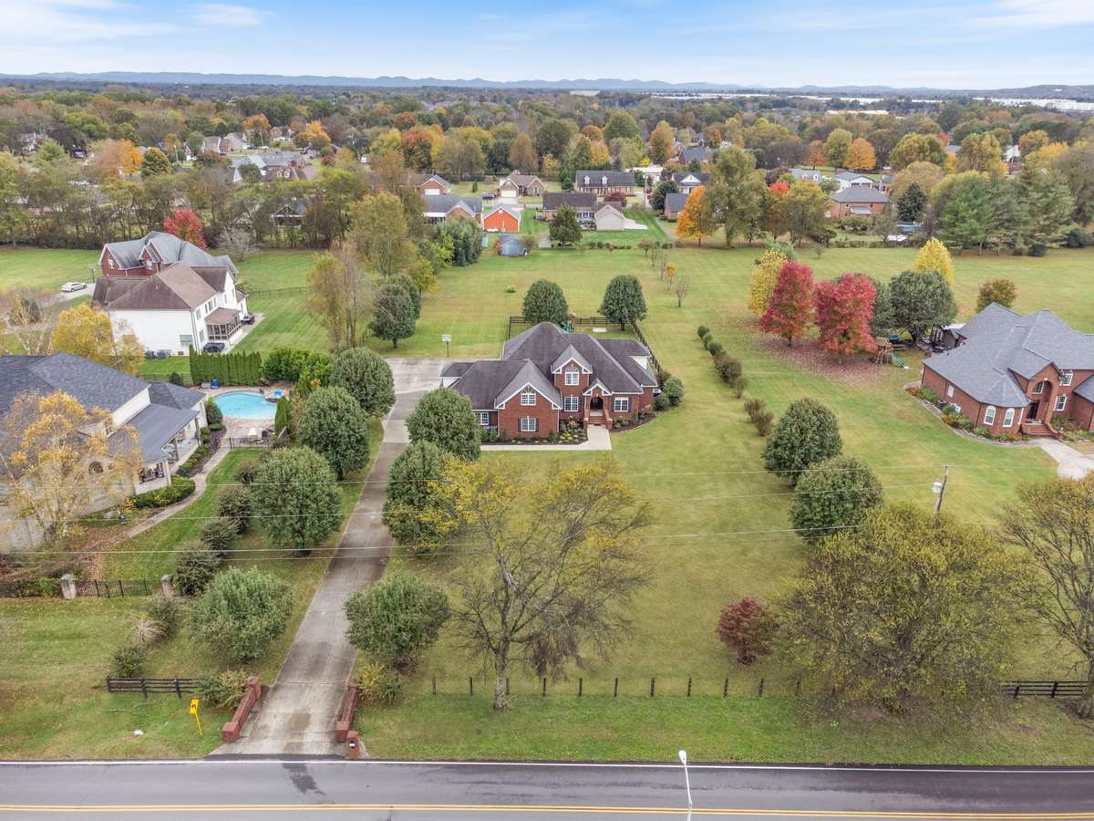 The tree lined driveway welcomes you home and provides the perfect amount of privacy.