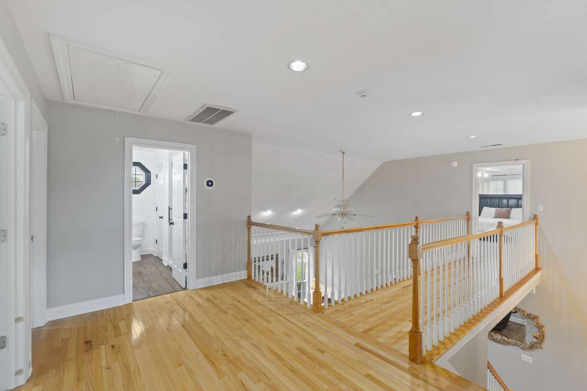 Spacious upstairs hallway leading to the bedrooms. There are four bedrooms in this area of the home, two of which have en-suite bathrooms.