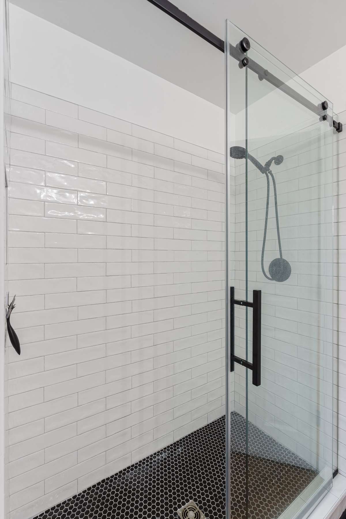 Walk in shower in upstairs hall bath.