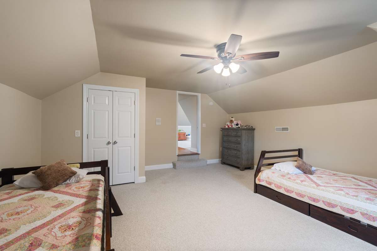 There is a 1/2 bath in the adjacent bonus room that is convenient for these two rooms on this private side of the home.