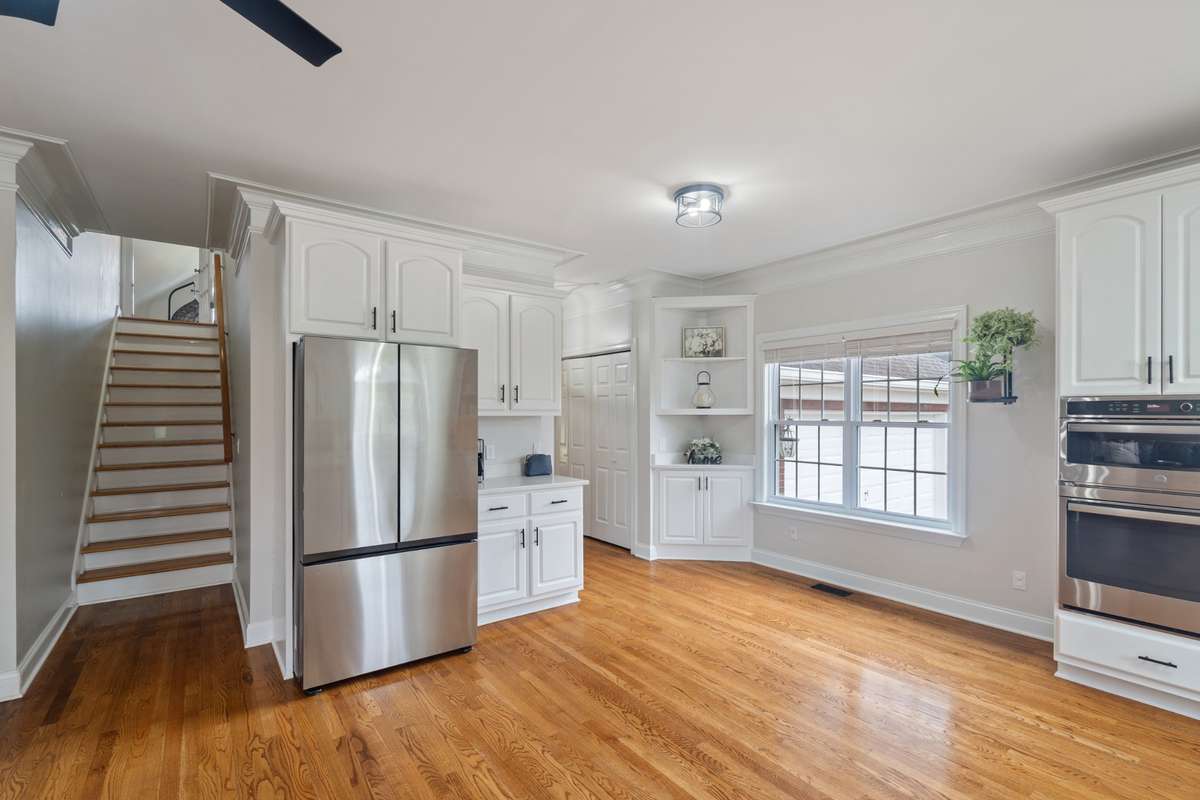 The kitchen layout allows for an additional breakfast space by the window. This home is designed with a second staircase accessing the bonus room and a first floor bonus room just off the kitchen, offering multiple living spaces to enjoy.