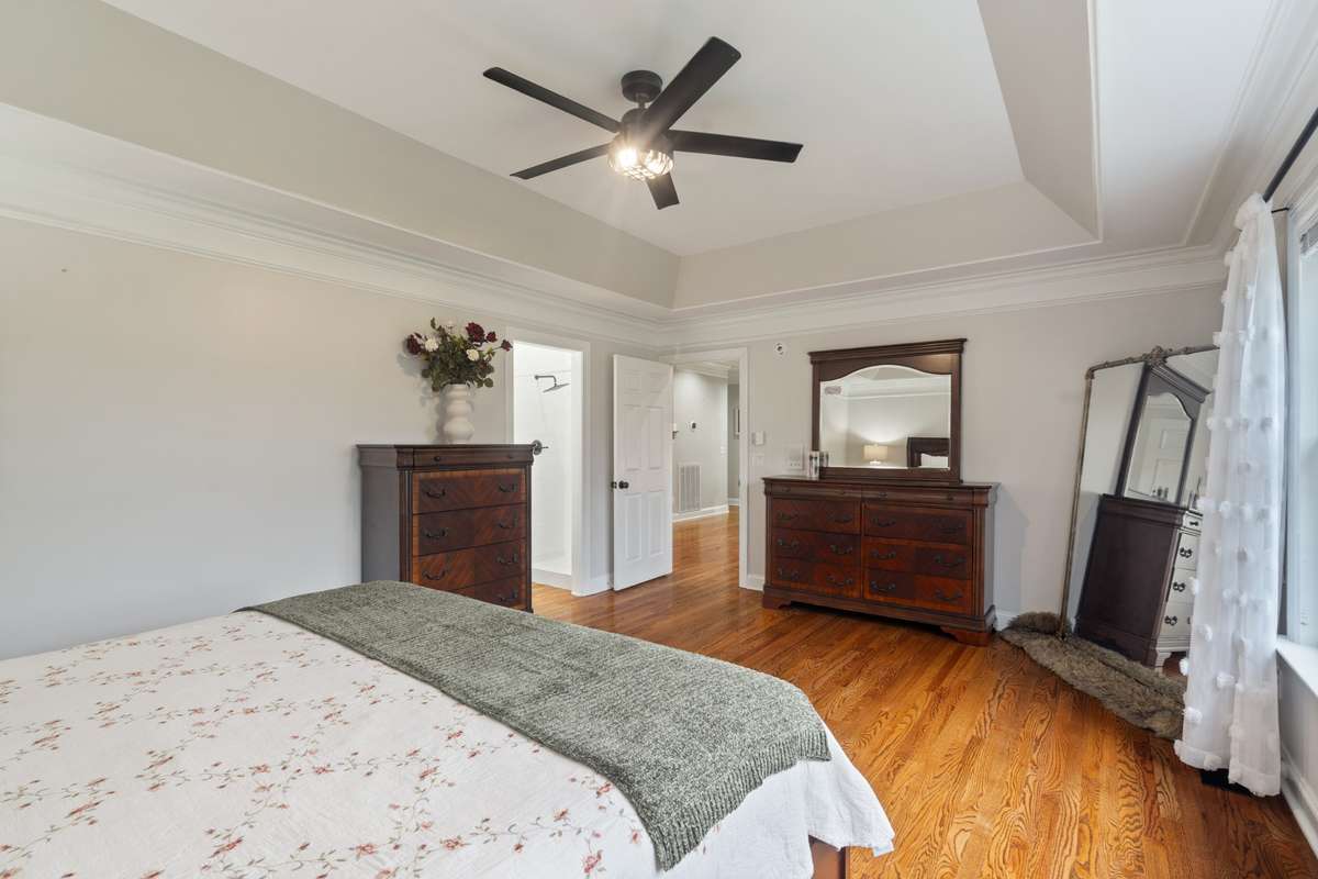 The tray ceiling, crown molding and hardwood floors set the tone for a restful retreat.