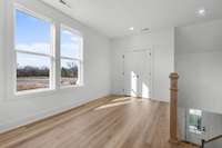 Photos  of Model Home. Floor plans and features may vary.