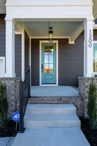 Photos  of Model Home. Floor plans and features may vary.